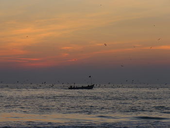 Scenic view of sea at sunset