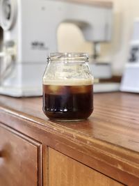 Close-up of coffee in jar on table