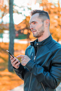 Young man using mobile phone