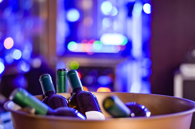 Close-up of wine bottles on table