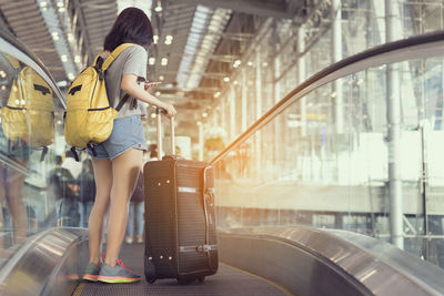 Woman standing at railway station