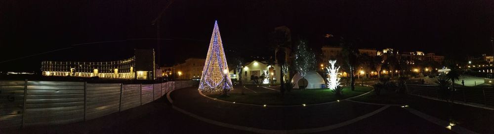 Illuminated buildings in city at night