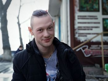 Portrait of man standing outdoors