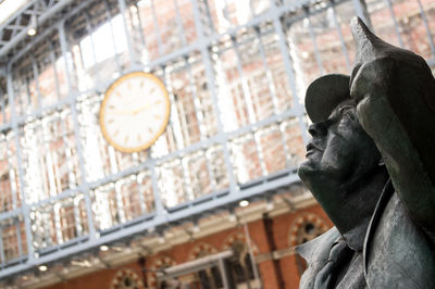 Low angle view of statue against building