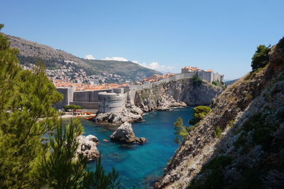 Panoramic view of city against blue sky