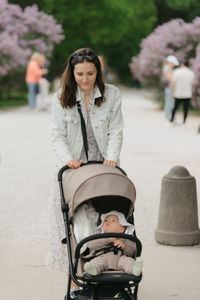 Portrait of young woman standing in park