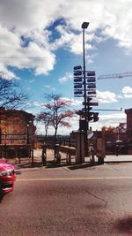 City street against cloudy sky