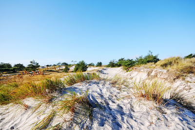 Scenic view of land against clear blue sky