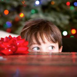 Close-up of boy at table during christmas