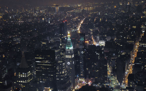 Aerial view of illuminated cityscape at night