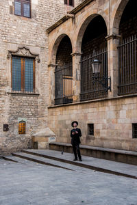 Full length of man standing in city