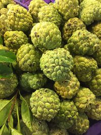 High angle view of custard apples heap at market stall
