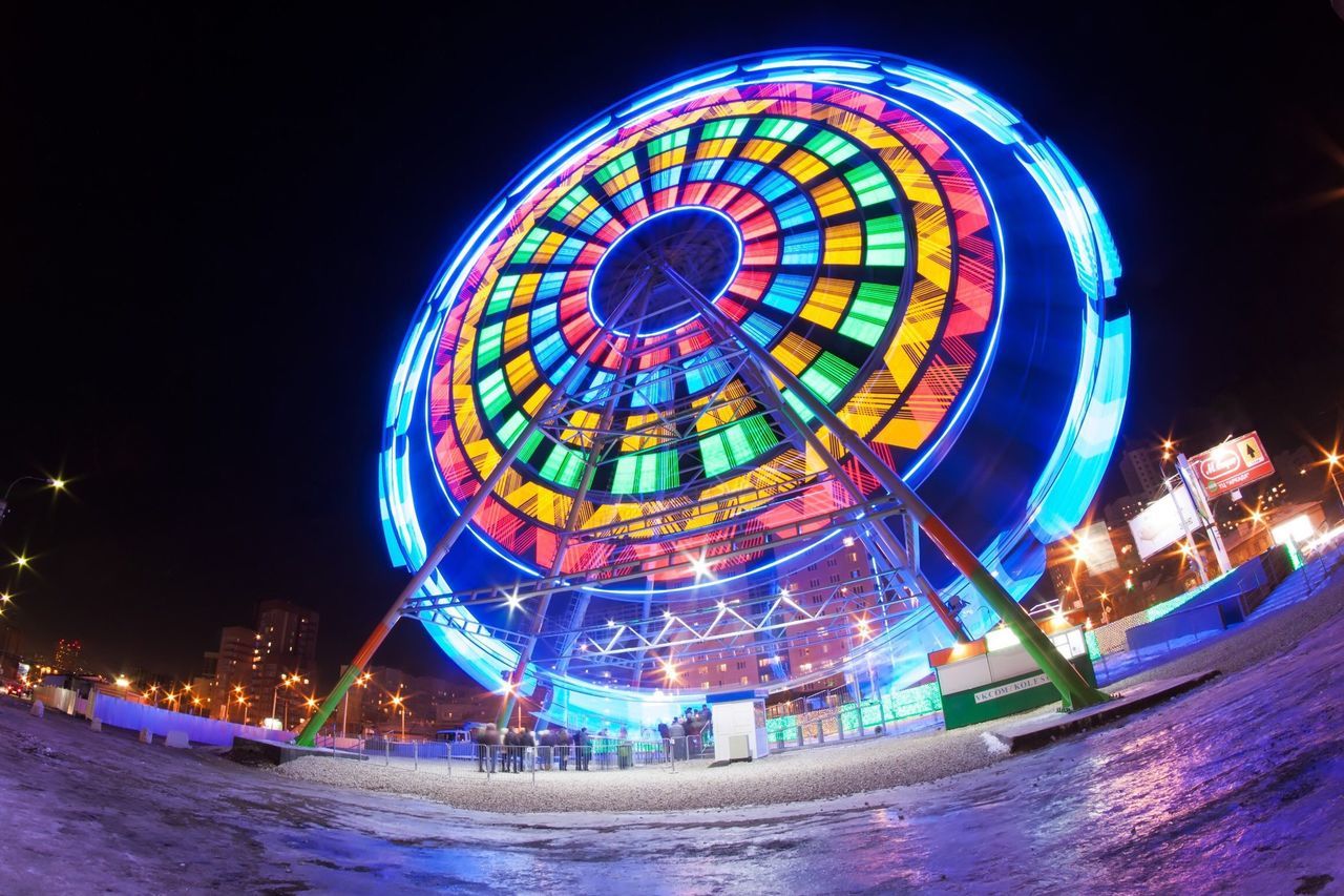 night, illuminated, built structure, architecture, multi colored, building exterior, blue, arts culture and entertainment, ferris wheel, circle, water, clear sky, amusement park ride, travel destinations, famous place, amusement park, copy space, travel, tourism, waterfront