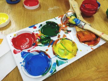 High angle view of paintbrushes on table
