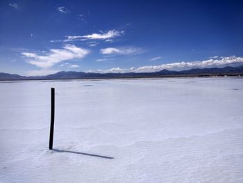 Scenic view of snow covered mountains against sky