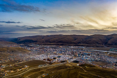 High angle view of townscape against sky during sunset