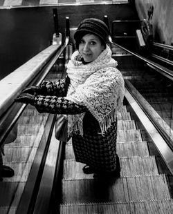 High angle portrait of woman standing on escalator at firenze santa maria novella railway station