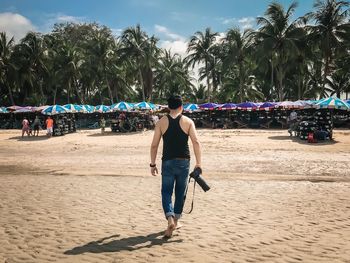 Rear view of people on beach