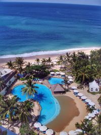 Scenic view of beach against blue sky