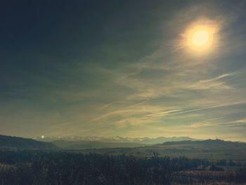 Scenic view of landscape against sky during sunset