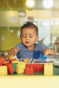 Portrait of cute boy with toy