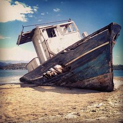 Abandoned boat in water