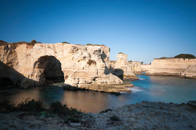 Scenic view of rock formation against clear blue sky