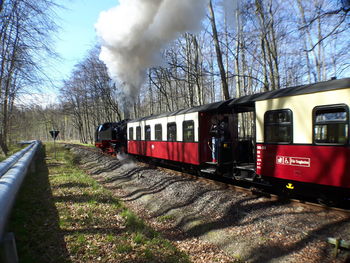 Train on railroad track against sky