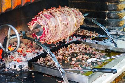 High angle view of meat on barbecue grill