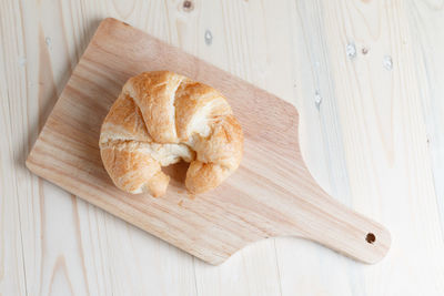 High angle view of bread on cutting board