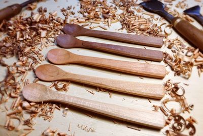 Close-up of wooden spoons arranged on table