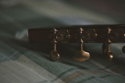 Close-up of guitar on table