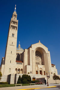 Low angle view of church against clear blue sky