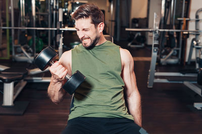 Young woman exercising in gym