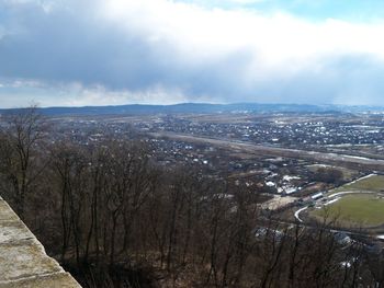 Scenic view of landscape against cloudy sky