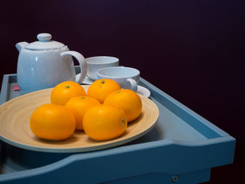 Close-up of fruits in plate on table