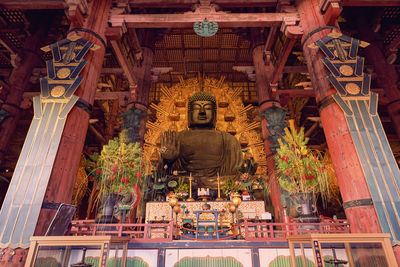 Low angle view of statue against building