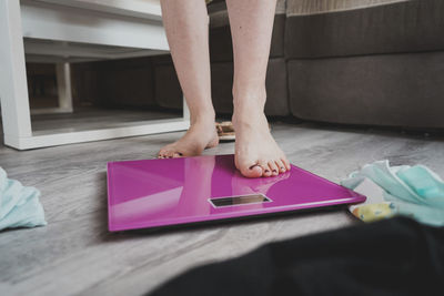 Low section of woman using laptop