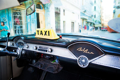 Close-up of vintage car on city