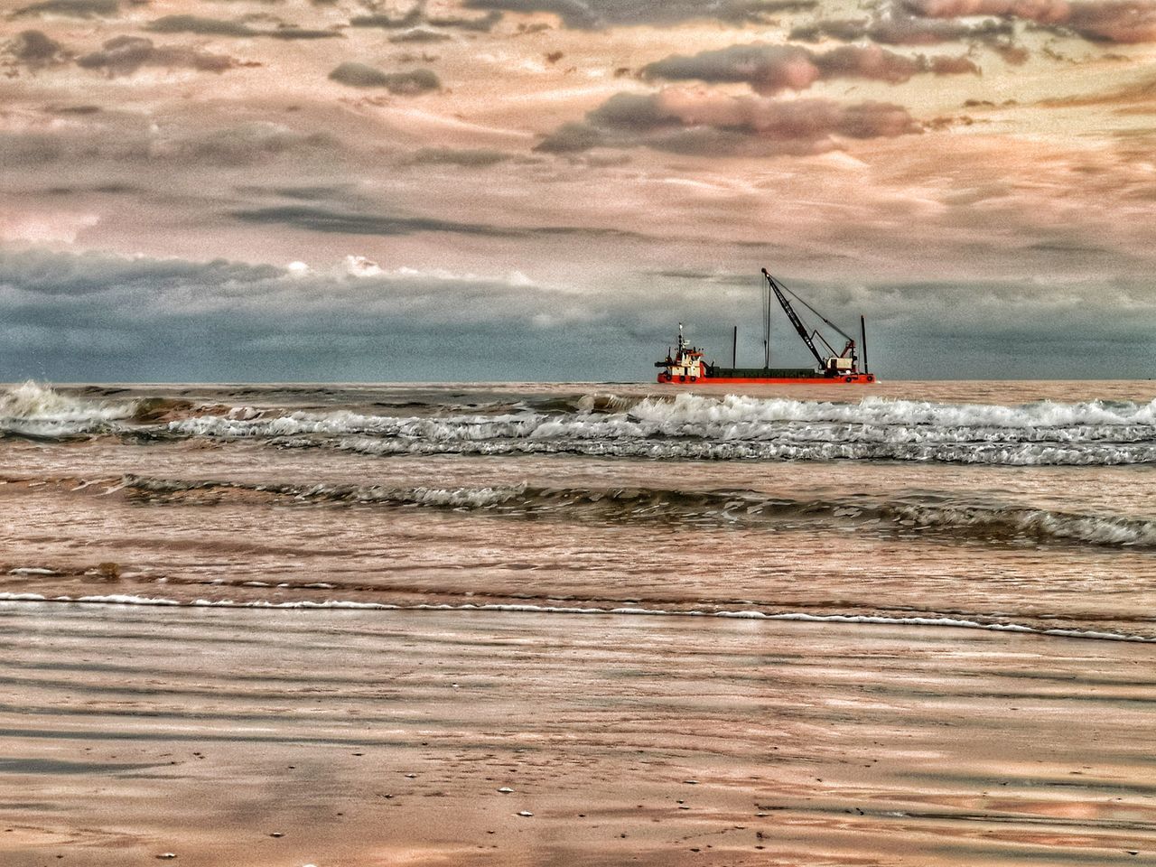 SAILBOAT ON SEA SHORE AGAINST SKY