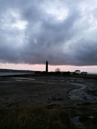 Scenic view of sea against storm clouds