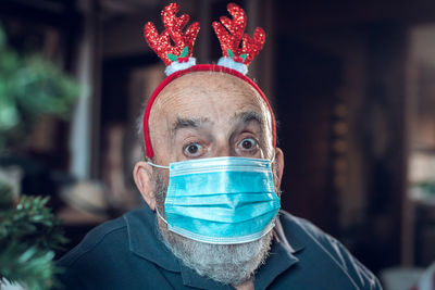 Close-up of man wearing hat