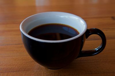 Close-up of coffee cup on table