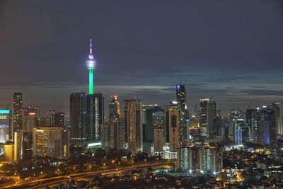 View of skyscrapers lit up at night