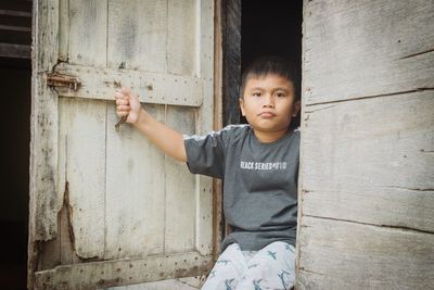 Portrait of cute boy standing outdoors