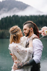 Young couple kissing in lake