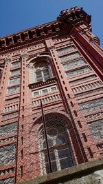 Low angle view of built structure against blue sky