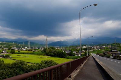 View of city against cloudy sky