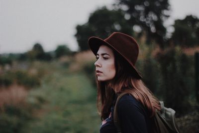 Portrait of young woman looking away