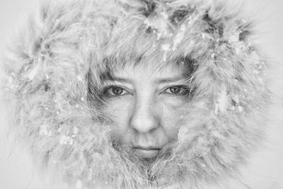 Close-up portrait of snow on dirt road during winter